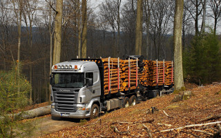 Truck hauling logs dirt road 3 - a truck free wallpaper