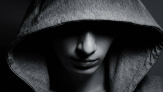 Hooded person cellphone portrait precisionism - deep shadow free wallpaper