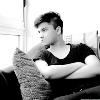 Man sitting couch arms crossed - his arm free wallpaper for tablet