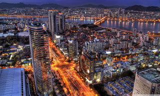 Cityscape tall buildings river nighttime 2 - free city wallpaper