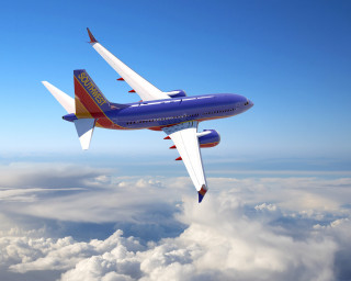 Large blue red airplane flying - free airplane wallpaper