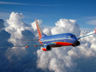 Blue red airplane flying clouds - cloud below free wallpaper
