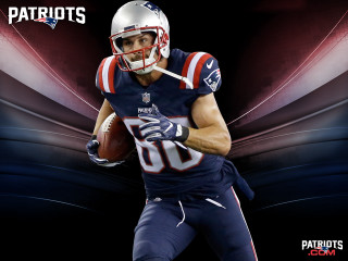 Football player holding football helmet 2 - a football player free wallpaper