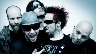 Tattooed men piercings group pose - one man free wallpaper