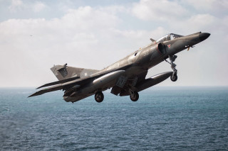 Fighter jet ocean cloudy landing - thierry doizon free wallpaper