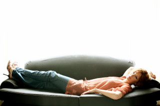 Woman couch crossed legs sunlight - a white room free wallpaper
