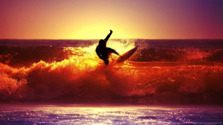 Surfer riding wave ocean sunset 6 - in the ocean free wallpaper