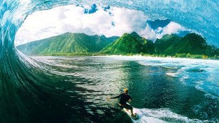 Man riding wave surfboard ocean 10 - evan charlton free wallpaper
