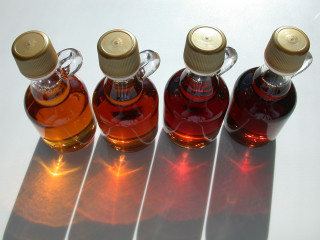 Three bottles liquid table shadow - product photo free wallpaper