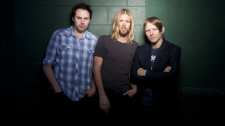 Three men standing room brick - one man free wallpaper