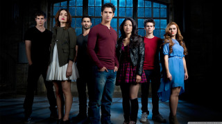 Group people window dark room 2 - a blue light behind them free wallpaper