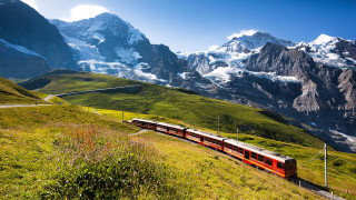 Train lush valley snowy mountains - a train traveling free wallpaper