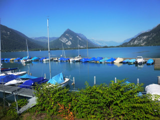 Boats water mountains bushes docked - bush free wallpaper