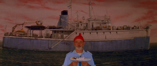 Man red hat holding paper - a painting of a boat free wallpaper