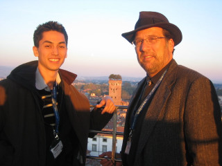 Men standing tall building tower - academic art free wallpaper