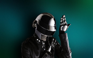Man leather suit helmet holding - the side of his face free wallpaper