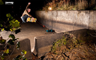 Man skateboarding cement ramp night - a cave painting free wallpaper