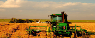 Tractor driving field crops fall - a tractor free wallpaper