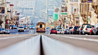 Trolley city street buildings traffic 2 - a trolley car free wallpaper