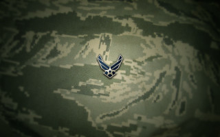 Military uniform badge camouflage background - symbolism free wallpaper