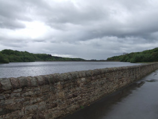 Stone wall water cloudy sky - panoramic free wallpaper