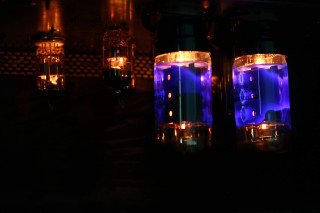 Table lights dark bottles illumination - a table in the dark free wallpaper