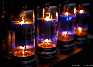 Glass tubes lit candles table - plasma free wallpaper