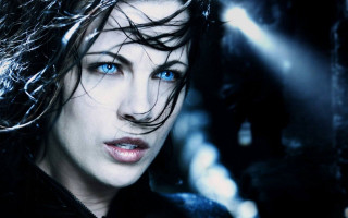 Woman blue eyes black jacket 2 - a black jacket free wallpaper for desktop
