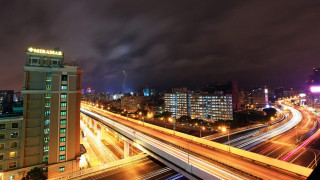 City skyline freeway bridge nighttime - long exposure free wallpaper for desktop