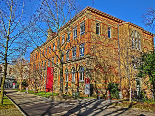 Large brick building red door - a large brick building free wallpaper