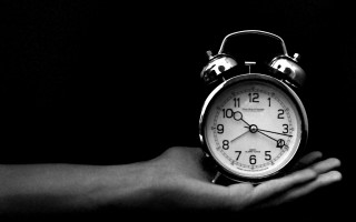 Person holding alarm clock dark 2 - their hand in free wallpaper