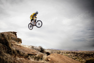Man bike jumping hill cloudy - derek hill free wallpaper
