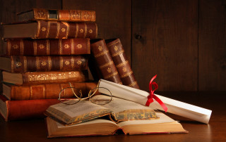 Stack books glasses red ribbon - a stack of books free wallpaper