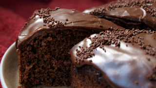 Chocolate cake frosting sprinkles slice - a chocolate cake free wallpaper