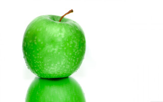 Green apple table white background - a green apple free wallpaper
