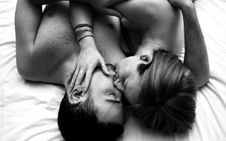 Man woman laying bed together - free love wallpaper