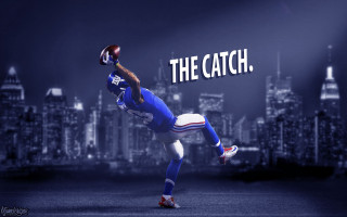 Football player catching ball cityscape 2 - a football player free wallpaper