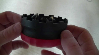 Person holding small tool with - a hole free wallpaper