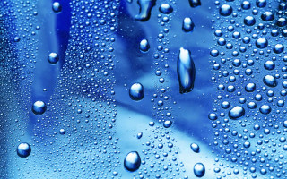 Water droplets blue surface background 4 - a blue surface free wallpaper