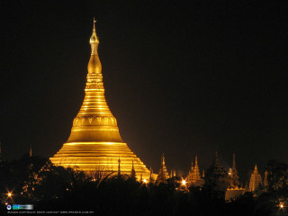 Golden building spire night lights - a spire free wallpaper