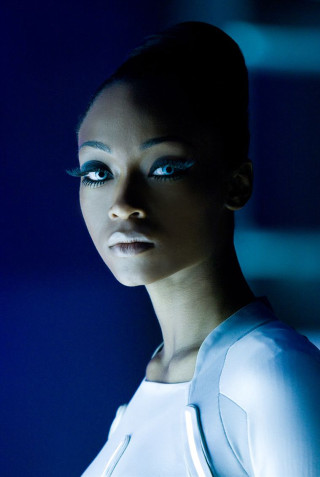 Afrofuturism blue eyes hologram daphne - a blue light behind her free wallpaper