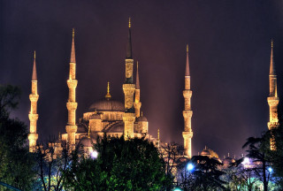 Large building spires lit up - hurufiyya free wallpaper