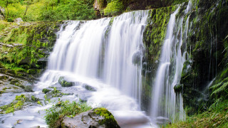 Waterfall lush green trees rocks - a stream free wallpaper