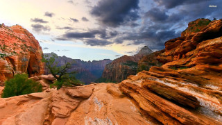 Mountain tall cliff cloudy sky - a cloudy sky above free wallpaper