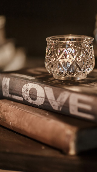 Glass candle holder book stack - a book free wallpaper for mobile