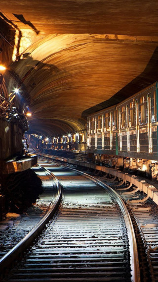 Train coming tunnel night time - a train free wallpaper for mobile