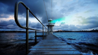 Pier lighthouse night cloudy sky - a light house free wallpaper