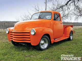 Orange truck parked field grass - clean line free wallpaper