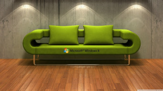 Green couch wooden floor lit - a green couch free wallpaper