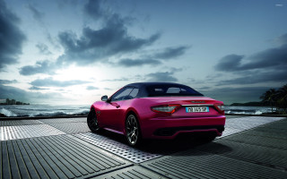 Pink sports car boardwalk ocean - rim free wallpaper